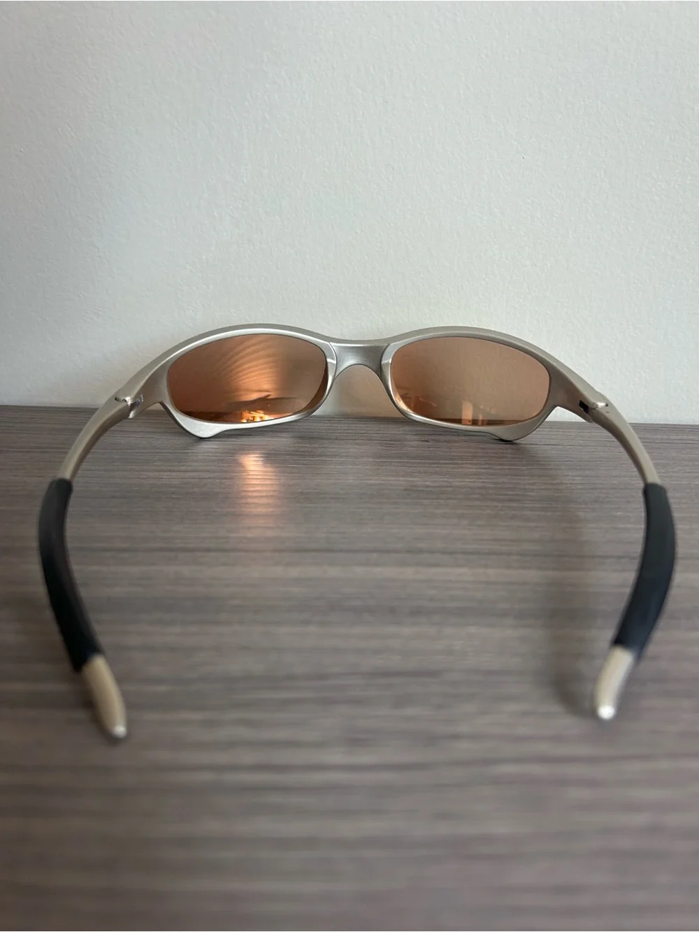 Oakley Silver Frame Sunglasses with Gold Mirrored Lenses